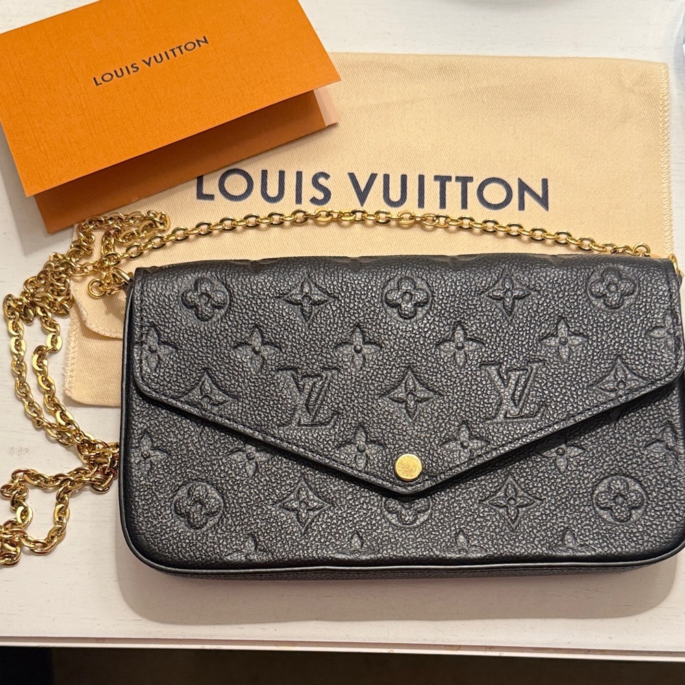 Louis Vuitton Black Monogram Clutch with Gold Chain and two interior wallets.